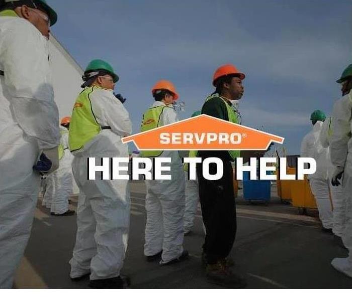 SERVPRO Employees in PPE, vests and hard hats 