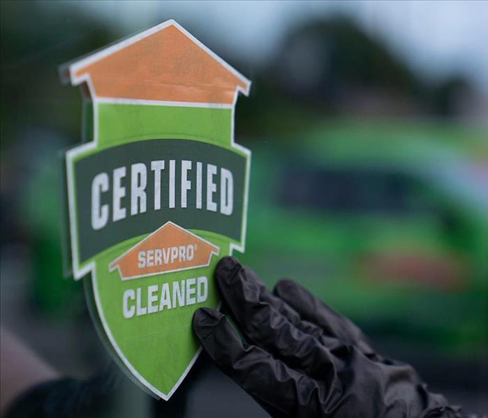 Certified: SERVPRO Cleaned sticker being placed on window