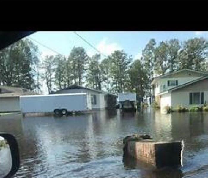 Flooding down the street in residential homes
