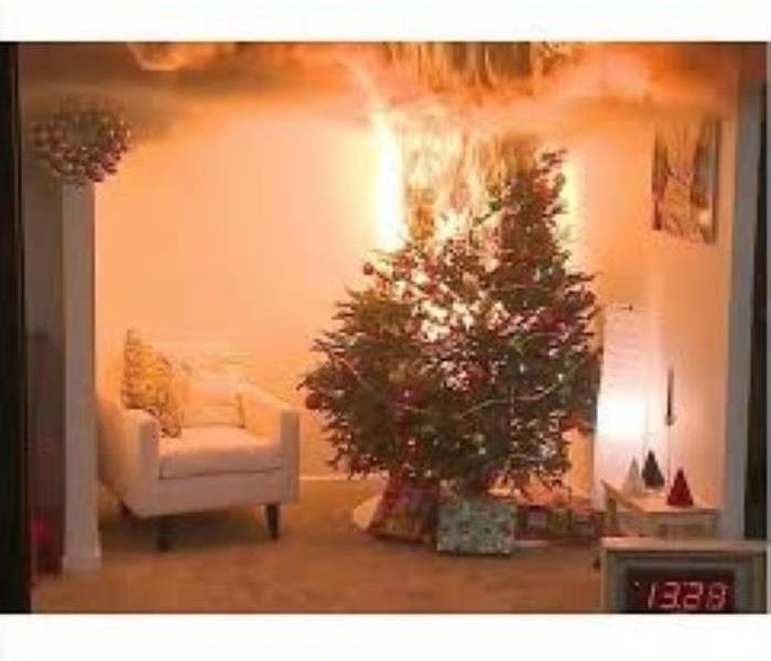 Christmas tree on fire in family livingroom 